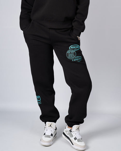 Joggers Suaitheantais Tiffany Dubh